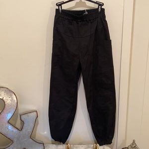 Baggy black pants.stretch waste & ankle. Pockets.M